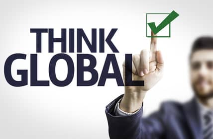 Business man pointing the text: Think Global