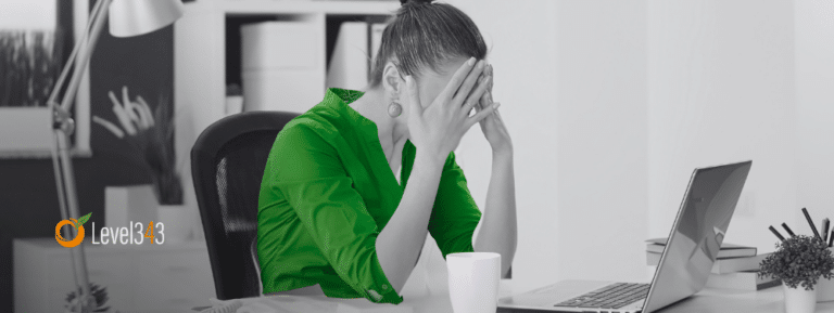 woman in an office realizing a mistake at the computer