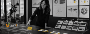 Marketing manager selects one yellow-highlighted data signal from several opportunities arranged across a black-and-white strategy table.