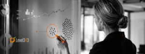 Business strategist uses an orange marker to select a right-sized action on a black-and-white planning board.