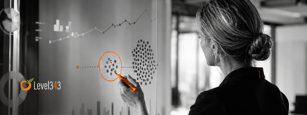 Business strategist uses an orange marker to select a right-sized action on a black-and-white planning board.