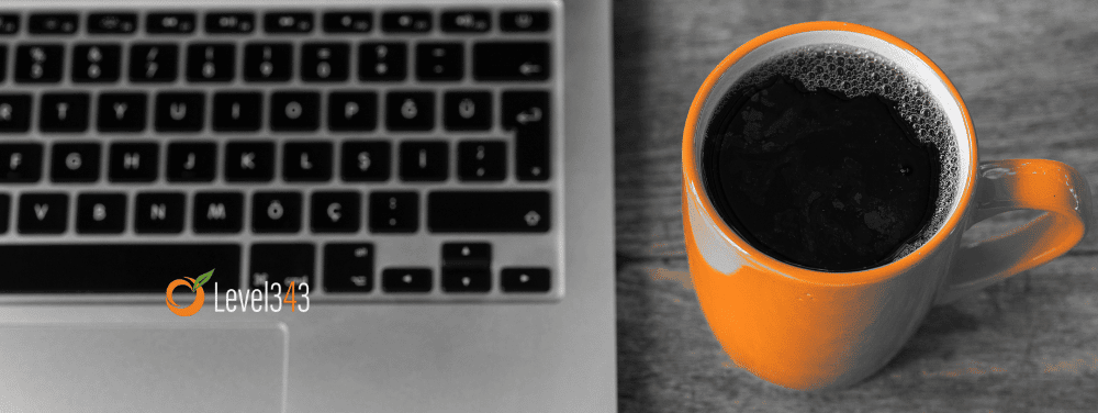 laptop with orange cup