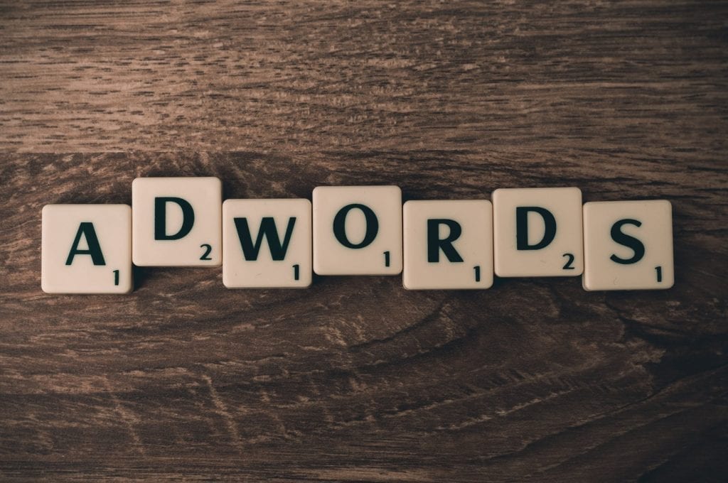 Adwords, now Google Ads, written in Scrabble letters