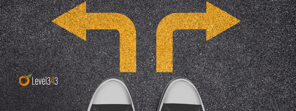 Person standing at a crossroads, choosing between two paths, representing the shift from tactical SEO to strategic direction.