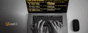 Hands typing code on a computer